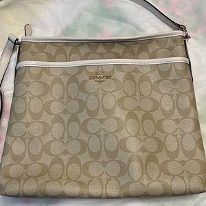 Coach crossbody, ivory with beige logo print.